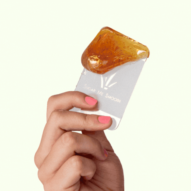 Gif showing woman's hand holding the flicker, spreading the sugar 3x, and flicking fast parallel to the skin
